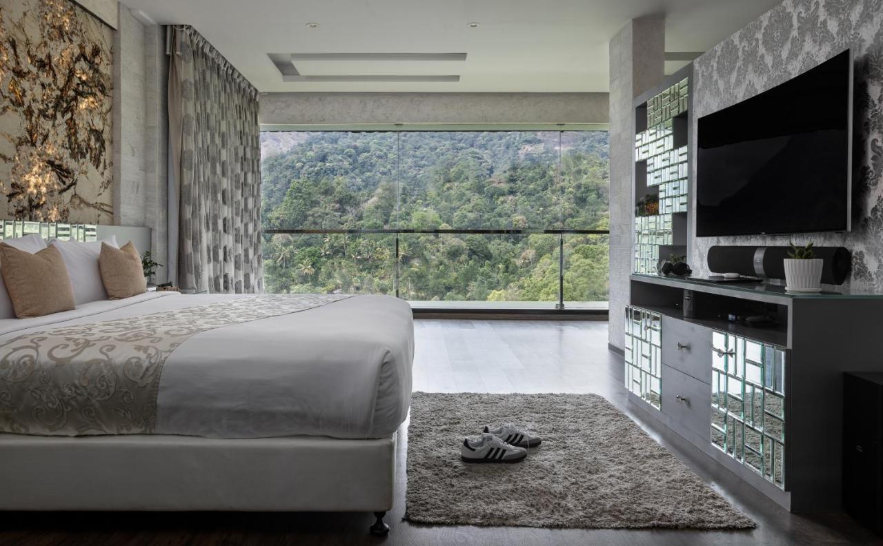 Hotel The Panoramic Getaway Munnar Exterior foto A bedroom at the hotel