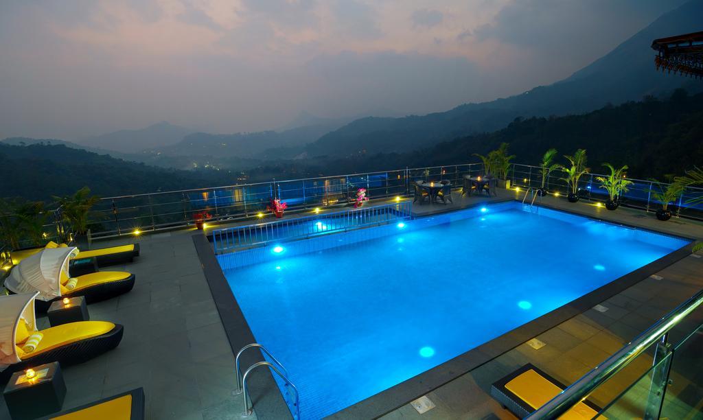 Hotel The Panoramic Getaway Munnar Exterior foto The swimming pool at the resort